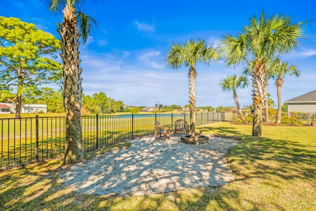 view of patio / terrace featuring a water view and an outdoor fire pit