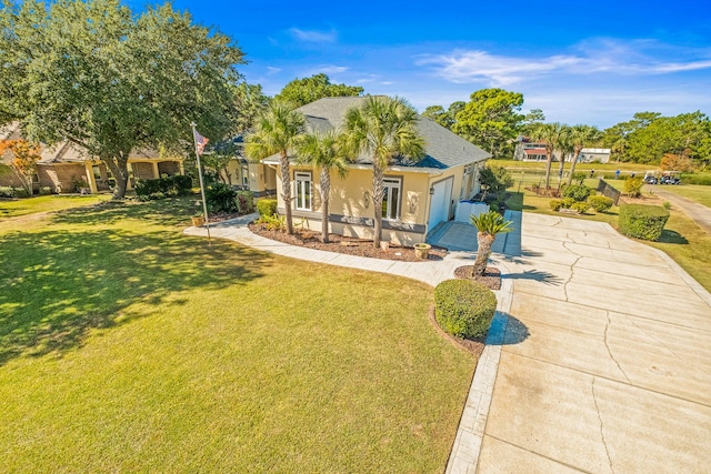 view of front facade with a garage and a front yard