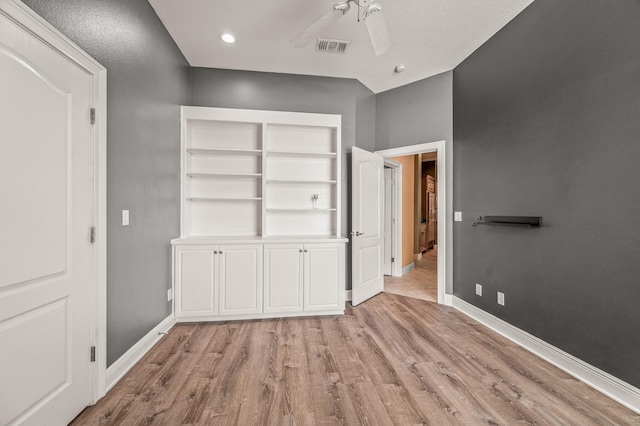unfurnished bedroom featuring visible vents, a ceiling fan, light wood-style flooring, and baseboards
