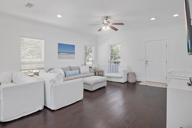 living room featuring visible vents, a ceiling fan, ornamental molding, dark wood-style flooring, and recessed lighting