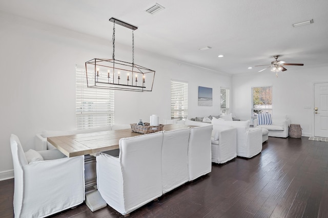 dining space with dark wood-type flooring, recessed lighting, visible vents, and a healthy amount of sunlight