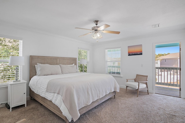 carpeted bedroom with access to exterior, visible vents, ornamental molding, ceiling fan, and baseboards