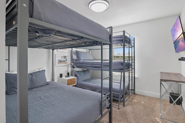 bedroom featuring baseboards and speckled floor