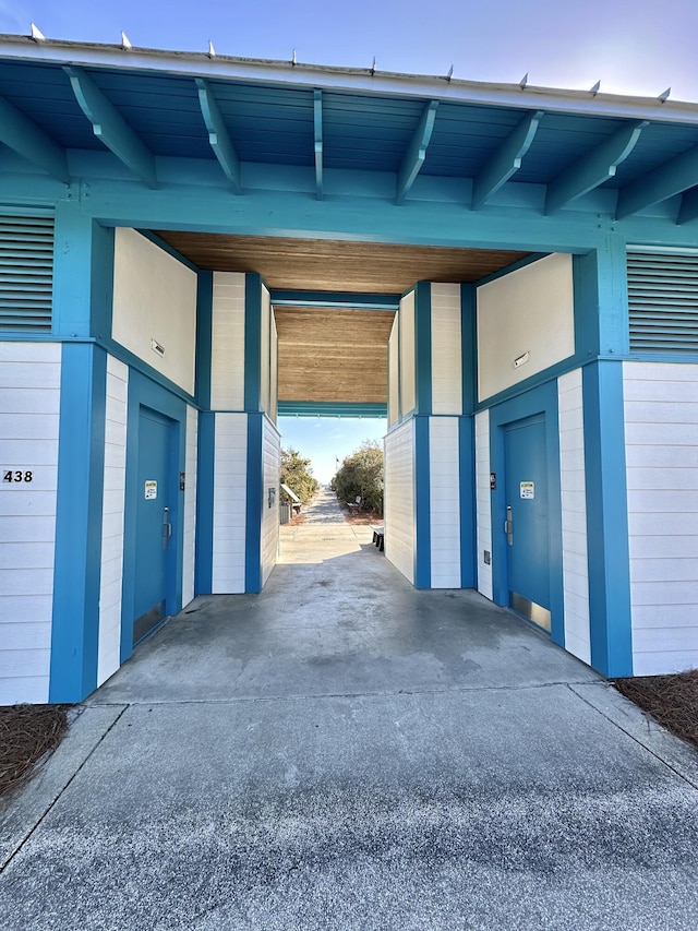 garage with an attached carport