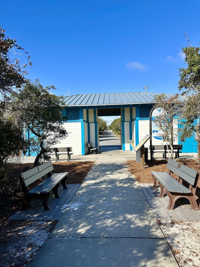 exterior space with driveway and an outdoor structure