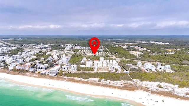 aerial view featuring a water view and a view of the beach