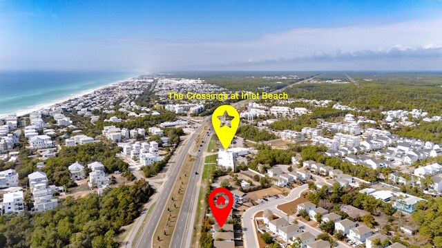 bird's eye view featuring a water view, a residential view, and a view of the beach