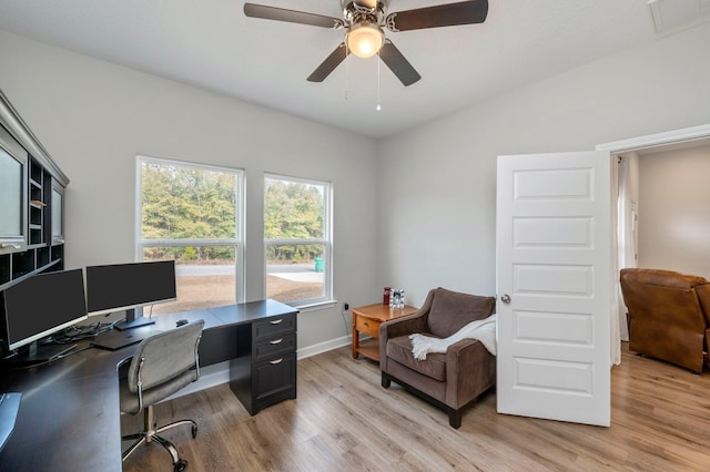 office featuring ceiling fan, lofted ceiling, and light wood-type flooring