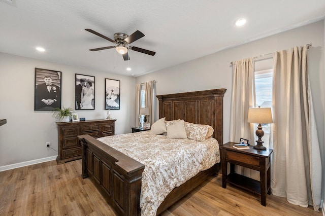 bedroom featuring light hardwood / wood-style flooring and ceiling fan