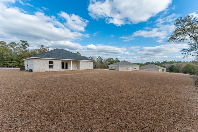 back of property with central AC unit