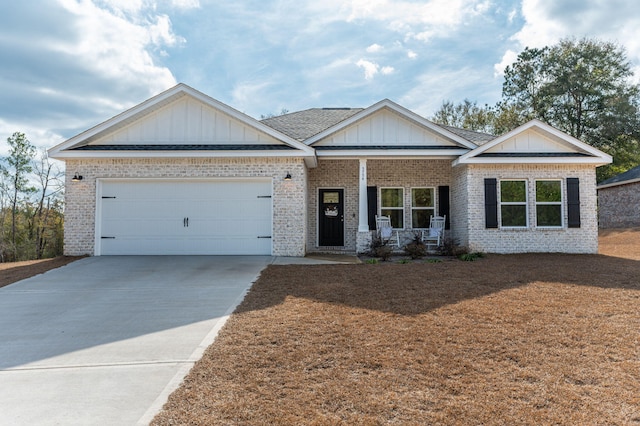 view of front of home featuring a garage and a porch