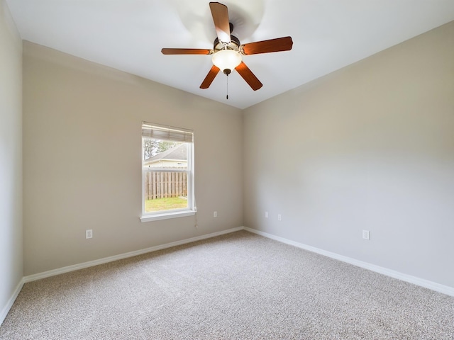 unfurnished room with carpet and ceiling fan