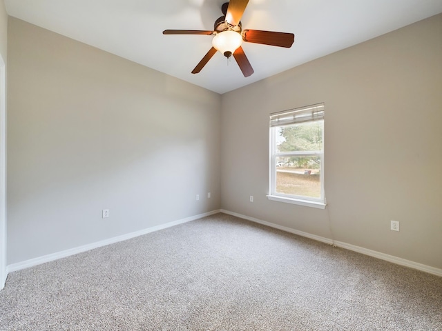 unfurnished room featuring ceiling fan and carpet flooring