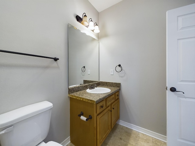 bathroom with toilet and vanity