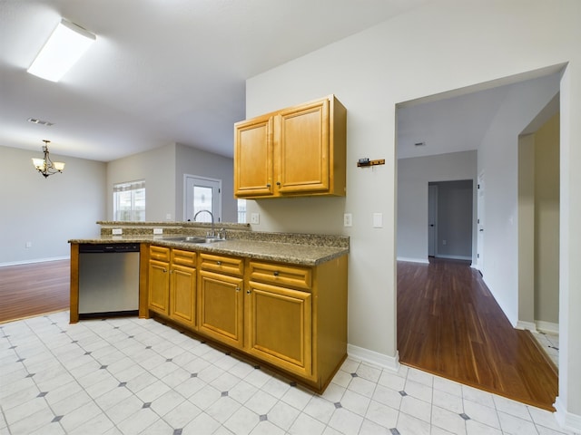 kitchen with dishwasher, light wood-type flooring, a chandelier, sink, and kitchen peninsula