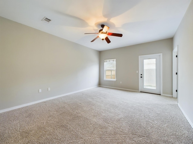 unfurnished room with light carpet and ceiling fan