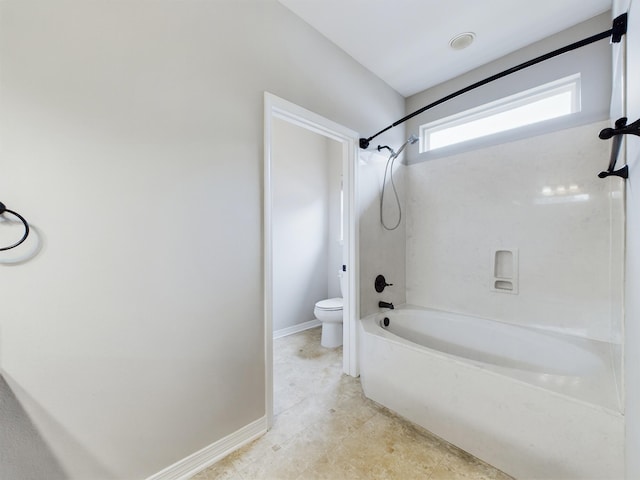 bathroom featuring toilet and shower / bath combination