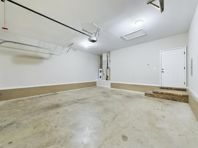 garage with a garage door opener and water heater