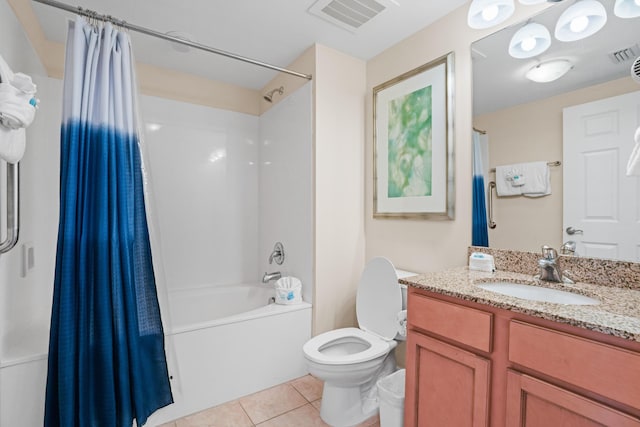 full bathroom with tile patterned floors, toilet, shower / bath combo with shower curtain, and vanity