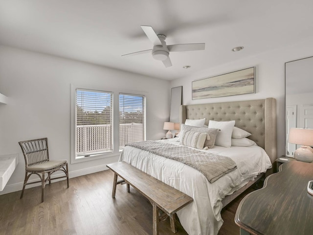 bedroom with hardwood / wood-style floors and ceiling fan