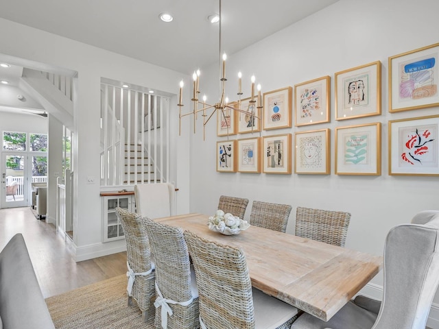 dining area featuring a chandelier and light wood-type flooring