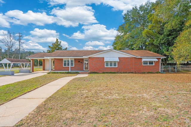 single story home with a carport and a front yard