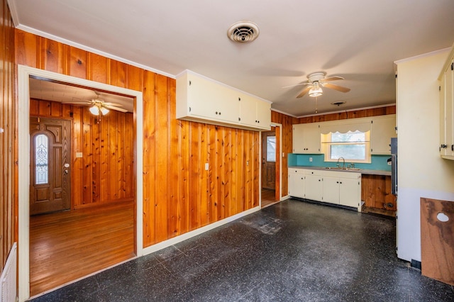 kitchen featuring ornamental molding, sink, and ceiling fan