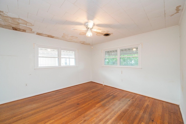 unfurnished room featuring hardwood / wood-style floors and ceiling fan