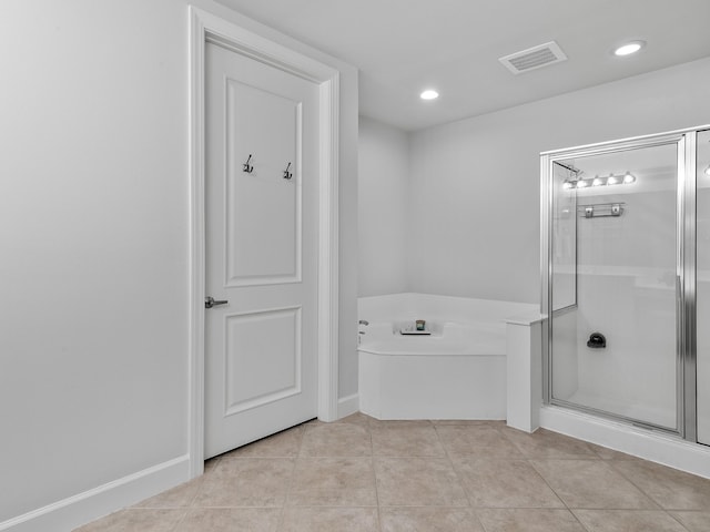 bathroom with tile patterned flooring and plus walk in shower