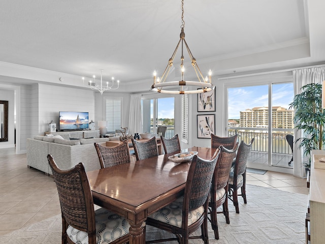 dining area featuring ornamental molding, plenty of natural light, light tile patterned flooring, and a notable chandelier