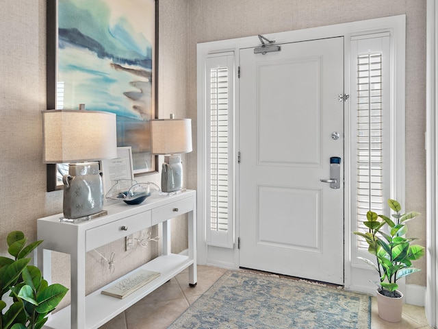 entryway featuring a healthy amount of sunlight and light tile patterned floors