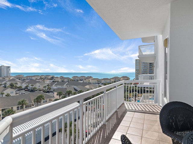 balcony featuring a water view