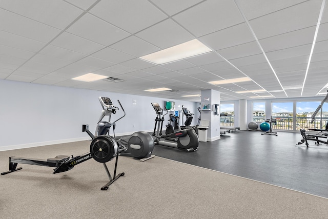 exercise room with a drop ceiling