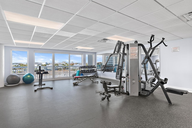 gym featuring a paneled ceiling