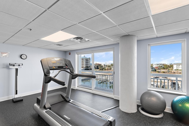 workout area with a paneled ceiling