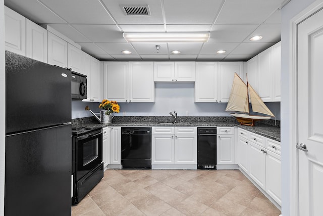 kitchen with white cabinetry, a paneled ceiling, sink, and black appliances