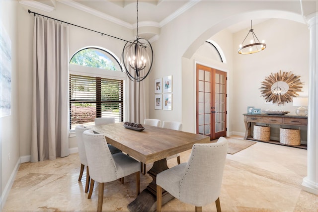 416 Admiral Ct, Destin, FL 32541 - dining space featuring a chandelier, french doors, arched walkways, crown molding, and baseboards