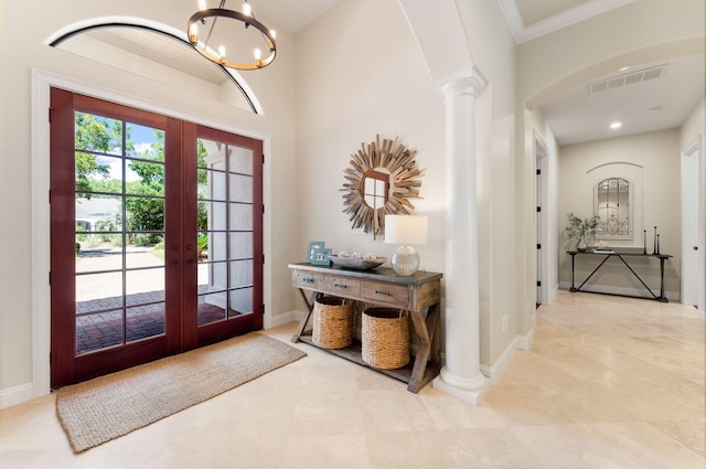 416 Admiral Ct, Destin, FL 32541 - tiled entrance foyer featuring french doors, decorative columns, a chandelier, baseboards, and ornamental molding