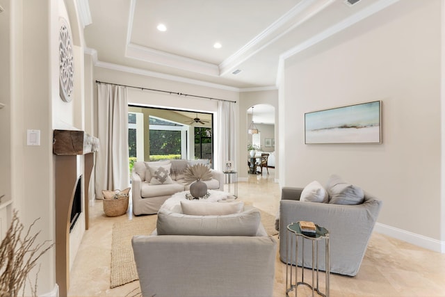 416 Admiral Ct, Destin, FL 32541 - living area featuring arched walkways, a raised ceiling, ornamental molding, recessed lighting, and baseboards