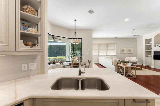 416 Admiral Ct, Destin, FL 32541 - kitchen with a sink, open floor plan, ceiling fan, wood finished floors, and decorative light fixtures