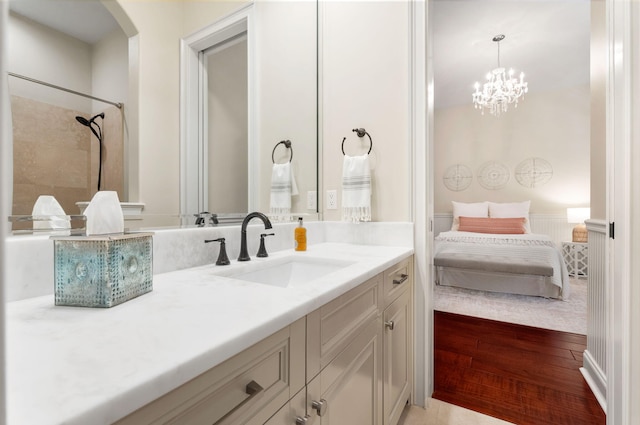416 Admiral Ct, Destin, FL 32541 - bathroom featuring ensuite bathroom, vanity, wood finished floors, and a chandelier