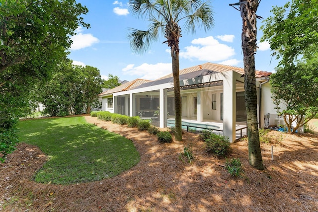 416 Admiral Ct, Destin, FL 32541 - back of property with a patio, glass enclosure, stucco siding, an outdoor pool, and a yard