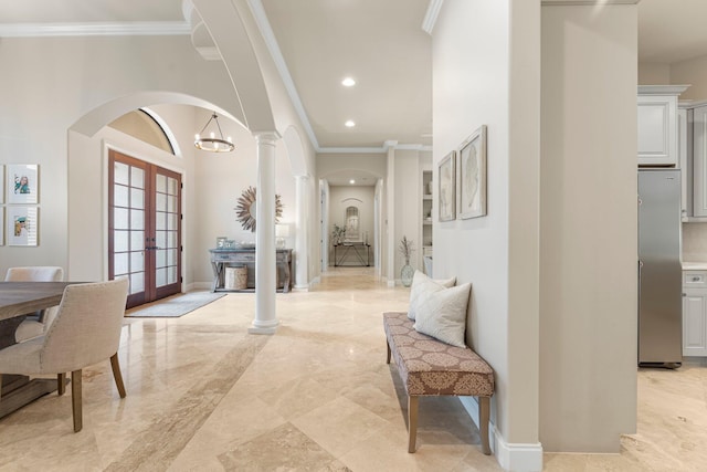 416 Admiral Ct, Destin, FL 32541 - foyer entrance with french doors, arched walkways, crown molding, recessed lighting, and baseboards