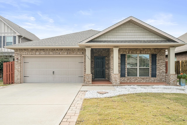 view of front of house featuring driveway, an attached garage, a shingled roof, a front lawn, and brick siding