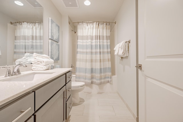 full bathroom featuring toilet, vanity, shower / bathtub combination with curtain, and tile patterned flooring