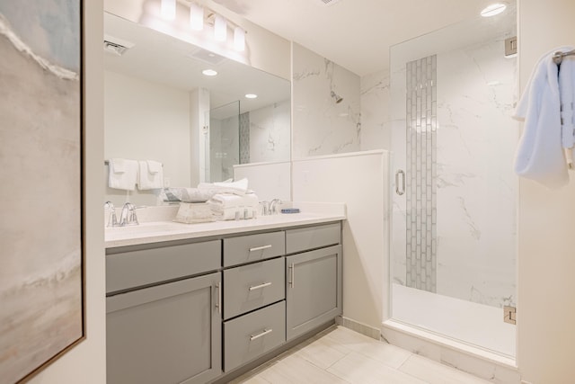 bathroom featuring vanity and an enclosed shower