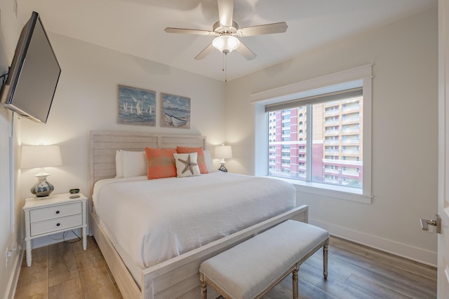 bedroom featuring ceiling fan and light wood-type flooring