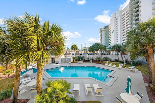 view of swimming pool featuring a patio area