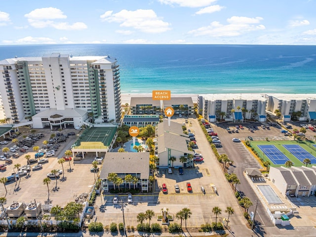 drone / aerial view featuring a water view and a view of the beach