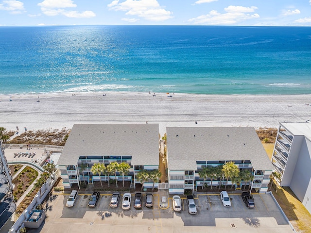 bird's eye view with a water view and a view of the beach